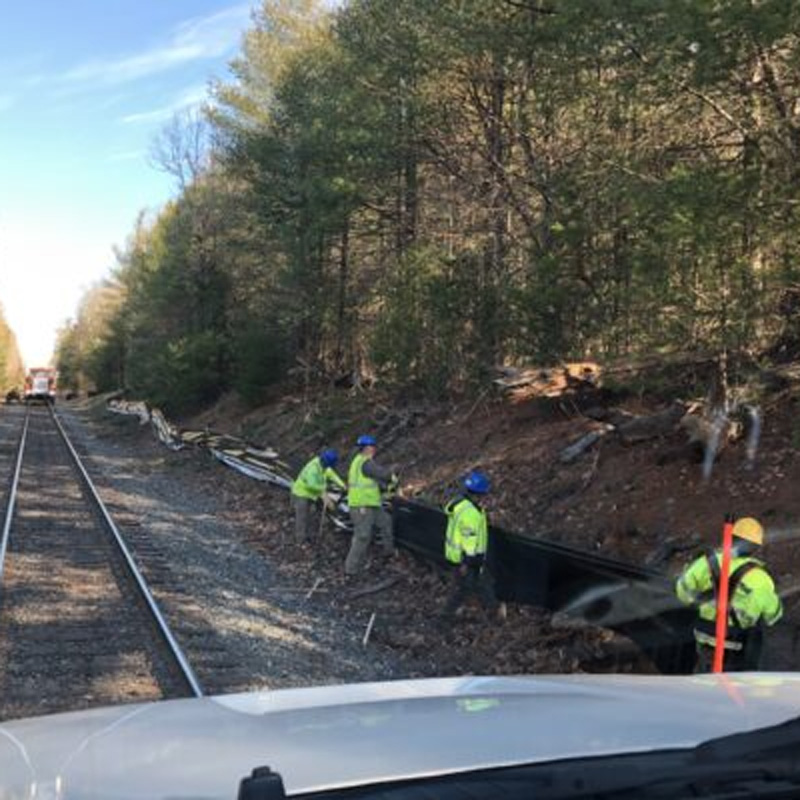 men installing filtermitt erosion control